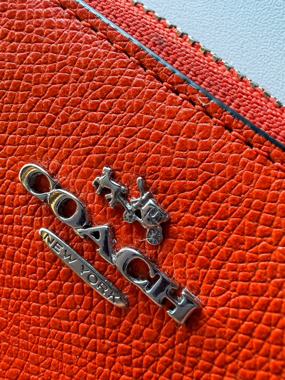 Coach Pebbled Leather Zip Wallet in Bright Orange with Silver Logo